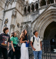Students exploring historic architecture during a law programme activity in London.