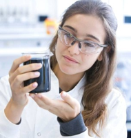 A student examining a laboratory sample during a medicine project in London.