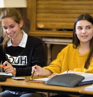 Students studying economics and finance together during a classroom session at Oxford.
